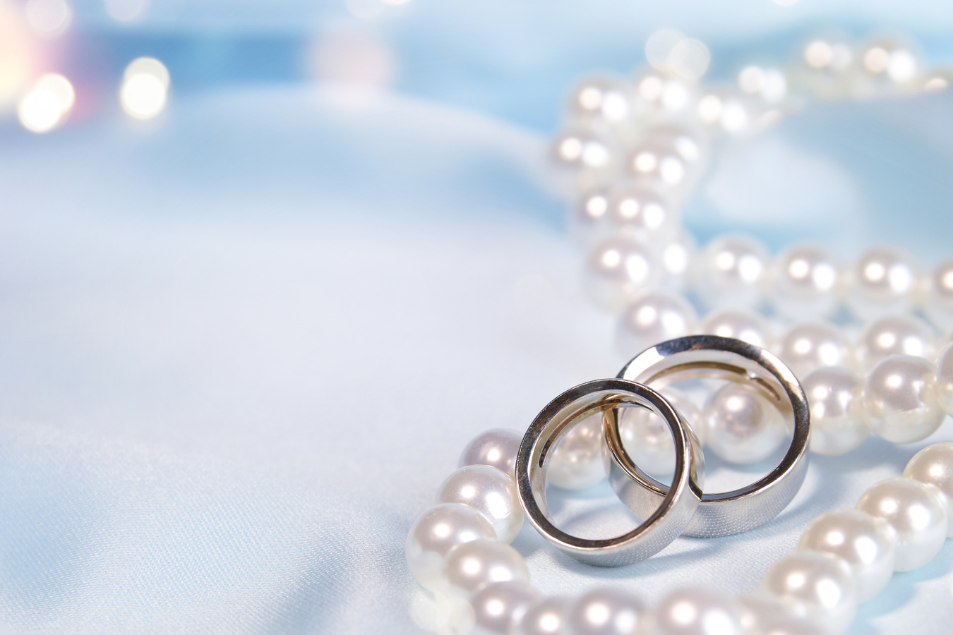 Wedding background with rings and pearls